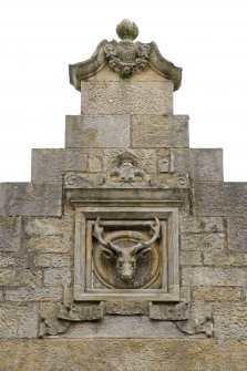 Main block. W side dated monogram panel. Detail