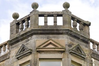 Main block. SE corner bay. Inscription. Detail