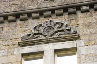 Tower. S side window pediment. Detail