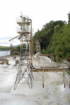 Elevated view of Towers 1 (fines, nearest camera) with its feed pipe carrying the crushed and washed sand fro the flotation tank (Floatex No.2), Towers 2 (standard) and 3 (standard) beyond.