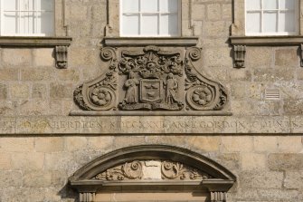Detail of coat of arms above doorway on NW facade