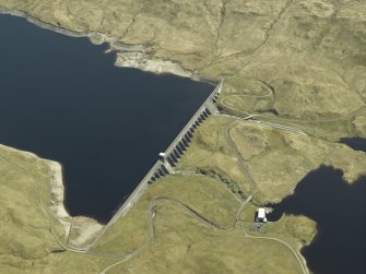 Oblique aerial view centred on the dam, power station and reservoir, taken from the WNW.