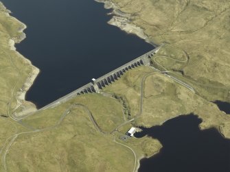 Oblique aerial view centred on the dam, power station and reservoir, taken from the WSW.