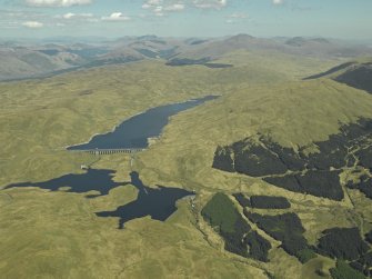 General oblique aerial view centred on the dams, power station and reservoir, taken from the WSW.