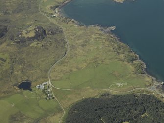 General oblique aerial view of the remains of the cairn and township, taken from the SE.