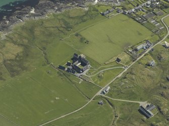 Oblique aerial view centred on the abbey, the Macleod Centre and the remains of the vallum, taken from the WNW.