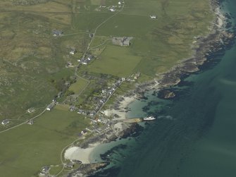 General oblique aerial view of the abbey and village, taken from the SSW.