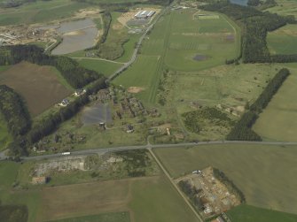 Oblique aerial view centred on the former barracks, taken from the ENE.