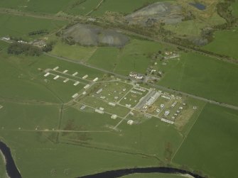 Oblique aerial view centred on the disused explosives factory, taken from the S.