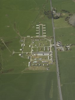 Oblique aerial view centred on the disused explosives factory, taken from the ESE.