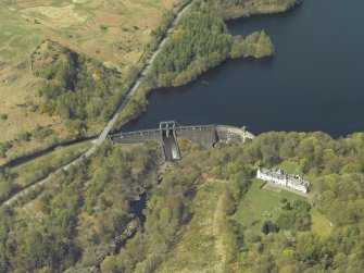 Oblique aerial view centred on the dam with the hotel adjacent, taken from the SE.