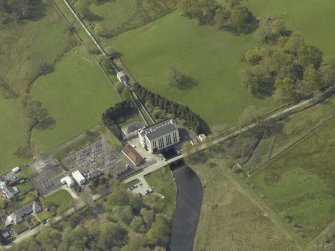 Oblique aerial view centred on the power station, taken from the ENE.