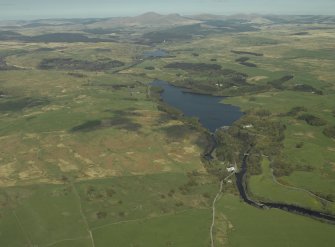 General oblique aerial view centred on the loch with the power station in the middle distance, taken from the S.