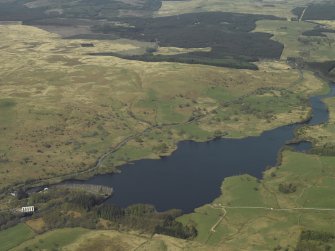 Oblique aerial view centred on the loch with the dam and power station to the left, taken from the E.