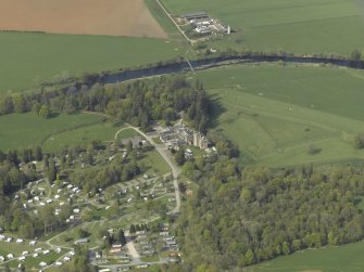 Oblique aerial view centred on the country house with the caravan park adjacent, taken from the SSE.
