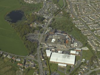 Oblique aerial view centred on the factory, taken from the SSW.
