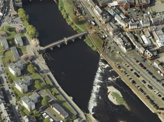 Oblique aerial view centred on the road bridge and weir, taken from the SSE.