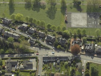 Oblique aerial view centred on the houses, taken from the ENE.