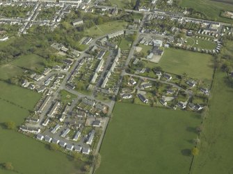 Oblique aerial view centred on the village, taken from the NNW.