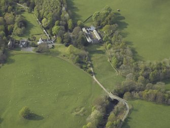 Oblique aerial view of the bridge, steading and country house, taken from the SSE.