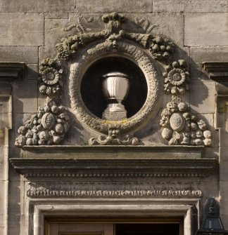 Detail.  Stonework frieze above entranceway from E.