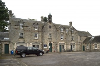 View of courtyard area flooking to main block and clock tower rom SE