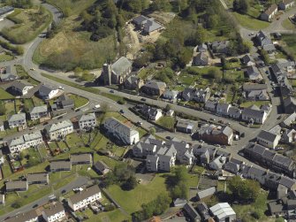 General oblique aerial view looking towards the Church, centred on the High Main Street, taken from the SW.