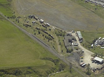 General oblique aerial view centred on the remains of the Minnivey Colliery (now the Scottish Industrial Railway Centre) with the mineral railway in the foreground, taken from the NW.