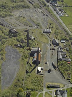 Oblique aerial view of the remains of the ironworks,  taken from the NW.