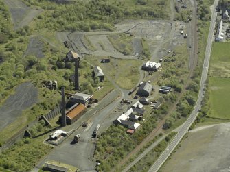 Oblique aerial view of the remains of the ironworks, taken from the WNW.