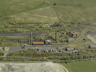 Oblique aerial view of the remains of the ironworks, taken from the SSW.