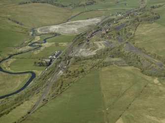 General oblique aerial view centred on the remains of Minnivey Colliery (now the Scottish Industrial Railway Centre) with the mineral railway in the foreground, taken from the ENE.