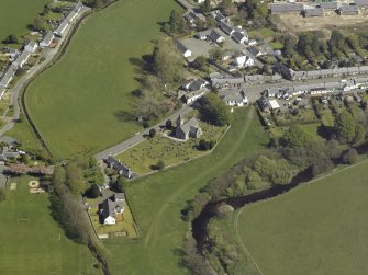 General oblique aerial view centred on the Church, taken from the SW.