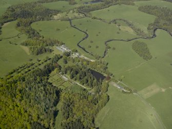 Oblique aerial view centred on the walled garden with Blairquhan House and stable block adjacent, taken from the SE.
