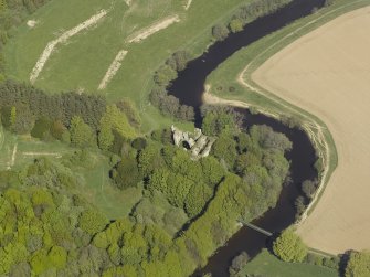 Oblique aerial view centred on the remains of the old castle, taken from the S.