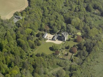 Oblique aerial view centred on the castle and country house, taken from the SW.