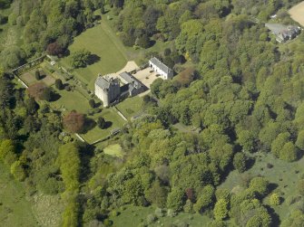 Oblique aerial view centred on the castle and country house, taken from the E.