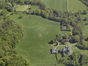 General oblique aerial view of the castle, country house and walled garden, taken from the WSW.
