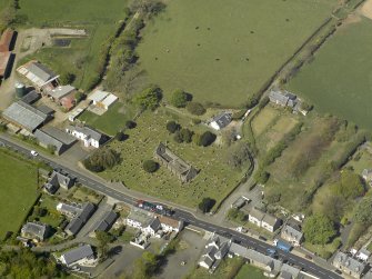 General oblique aerial view centred on the ruins of the Church, taken from the SE.