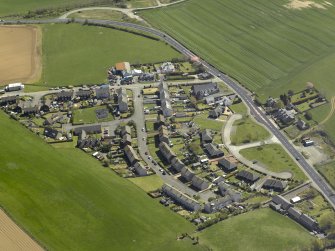 General oblique aerial view of the village, taken from the NW.
