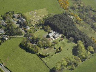 Oblique aerial view centred on Glebe house, taken from the NW.