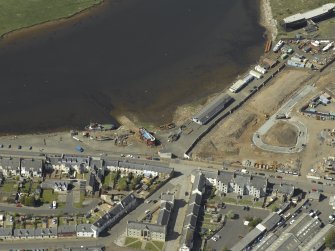 Oblique aeriall view centred on harbour, taken from the SE.