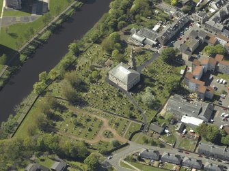 Oblique aerial view centred on the Church with the churchyard adjacent, taken from the E.