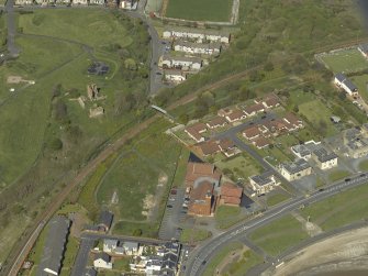 Oblique aerial view centred the Church with the remains of Ardrossan Castle adjacent, taken from the SSW.