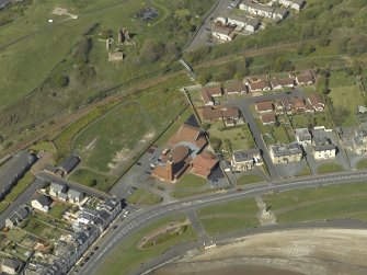 Oblique aerial view centred the Church with the remains of Ardrossan Castle adjacent, taken from the S.