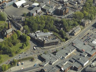 General oblique aerial view centred on the Corn Exchange, taken from the NW.