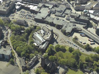 General oblique aerial view centred on the Corn Exchange, taken from the NE.