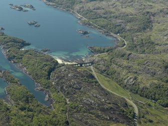 Oblique aerial view looking towards Loch nan Uamh centred on railway viaduct, taken from the ESE.