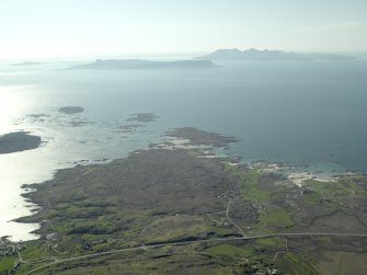 General oblique aerial view looking towards the Keppoch Peninsula and the distant Islands of Rum and Eigg centred on Back of Keppoch farmstead, taken from the E.