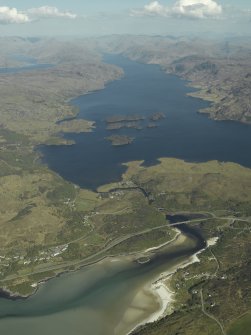 Oblique aerial view of Morar looking towards Loch Eilt centred on the railway viaduct and the new and old road bridges, taken from the W.